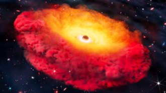 A sphere representing a black hole sits in the middle of a glowing gas cloud. The donut-shaped cloud is bright yellow towards the center and red towards the outer edge.